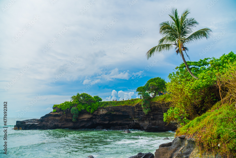 Panorama beach and cliffs in Tanah Lot temple, Bali, Indonesia.