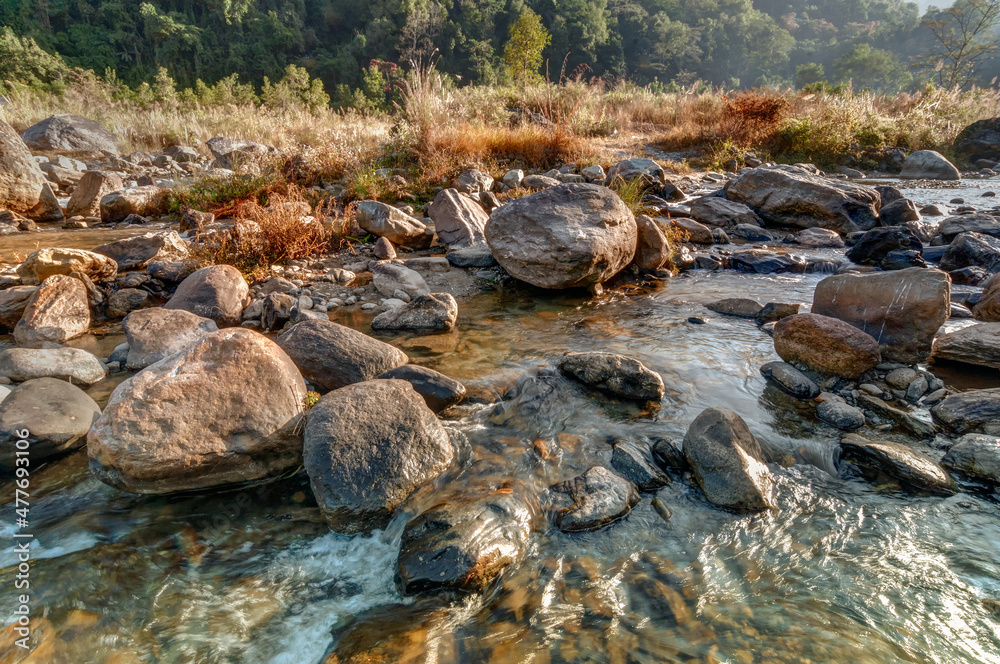 Beautiful Reshi River water flowing on rocks at dawn, Sikkim, India - a spectacular view , tinted image Beautiful Reshi River water flowing on rocks at dawn, Sikkim, India - a spectacular view , tinted image