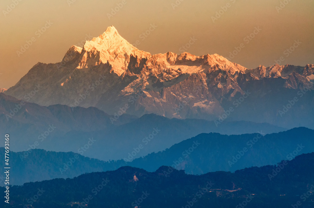 Beautiful view of Kanchenjunga mountain range with first daylight on it, at the background, moring light, at Sikkim, India