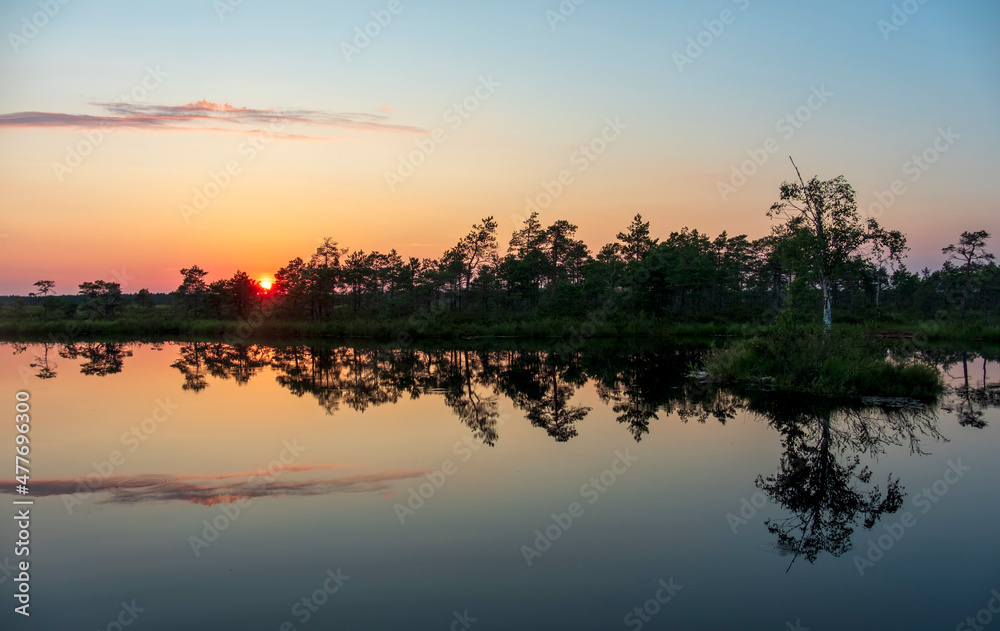 gorgeous sunset on a bog lake in estonia gorgeous sunset on a bog lake in estonia