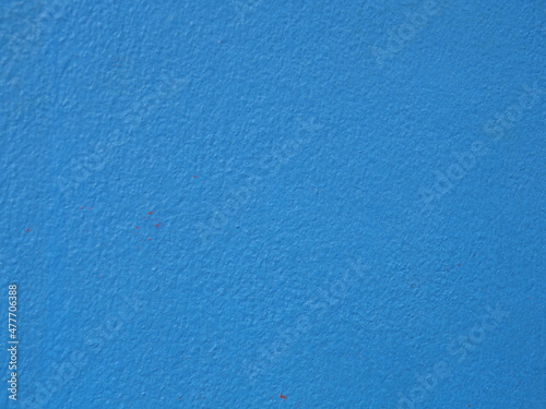 Bright blue picture on the wall, suitable for background.
