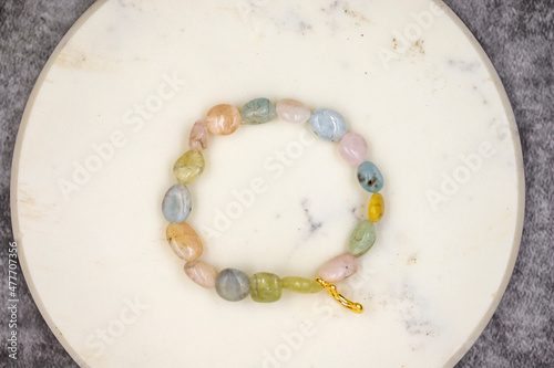 Bracelet made of natural stones on a dark background. Top view
