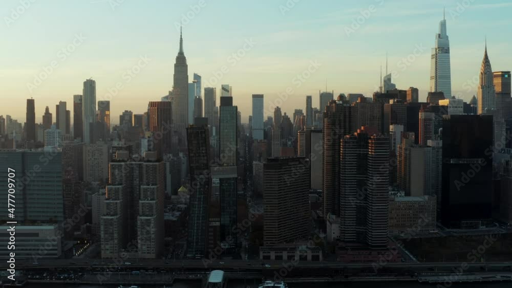 High rise buildings in midtown. Iconic Empire state building towering ...