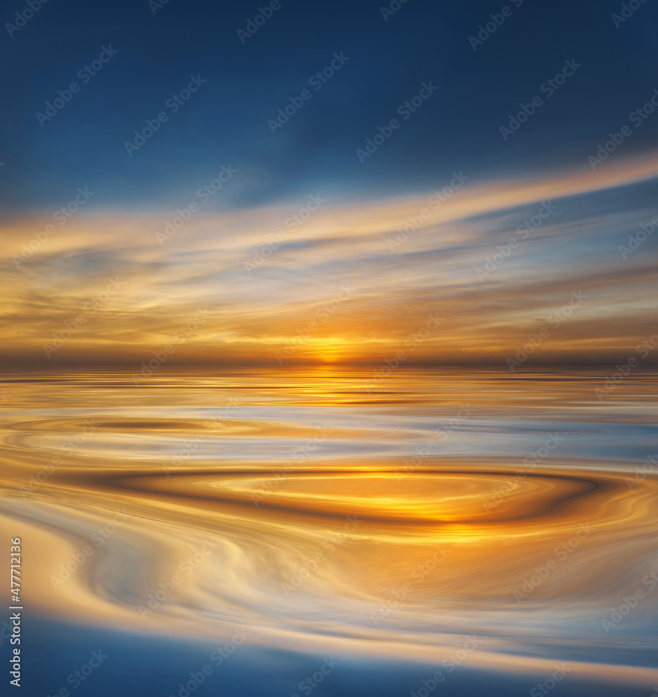 Sunset or sunrise reflected on smooth water