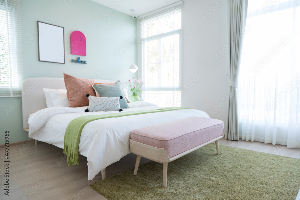 Stylish bedroom with modern green and yellow pillow and furniture. Interior design Stylish bedroom with modern green and yellow pillow and furniture. Interior design