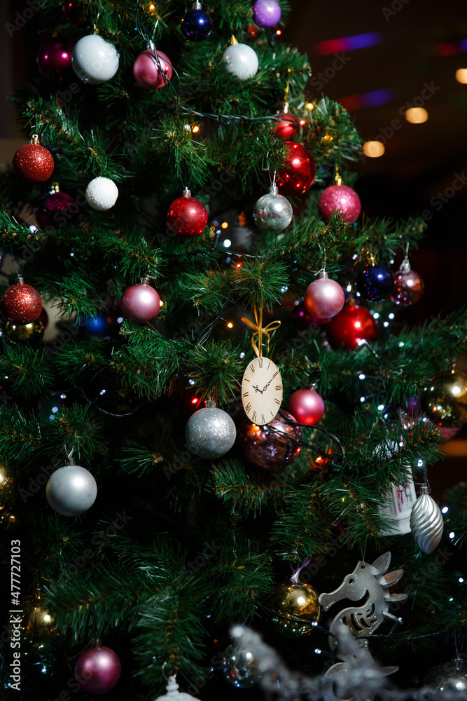 beautifully decorated with toys artificial Christmas tree