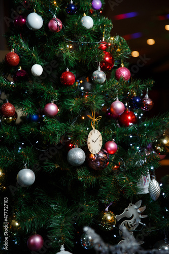 beautifully decorated with toys artificial Christmas tree
