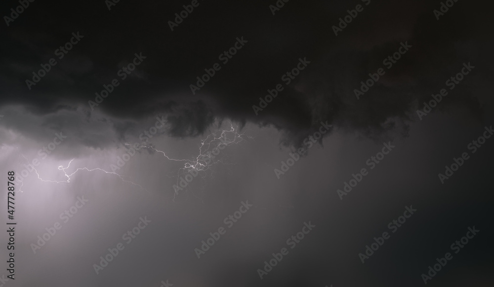 Fototapeta premium Heavy thunderstorm in the night. Weather alert because of lightning