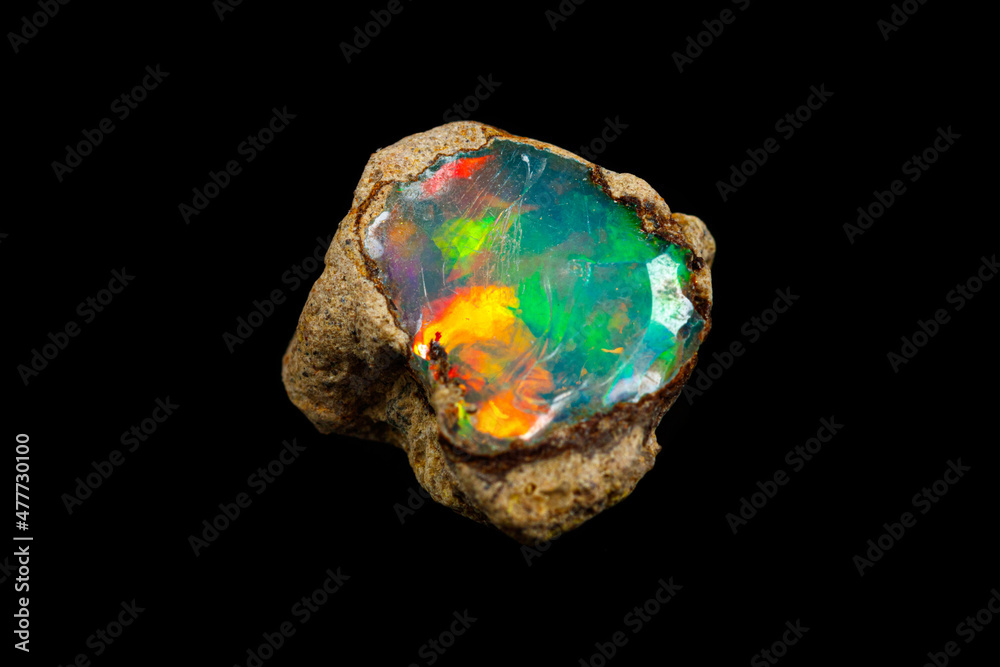 macro mineral stone rare and beautiful opals on a black background macro mineral stone rare and beautiful opals on a black background