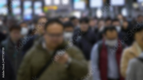 Wallpaper Mural Defocused shot of Japanese business people wearing surgical mask and walking to work at metro station. Omicron variant coronavirus pneumonia. Blurred background in the scene Torontodigital.ca