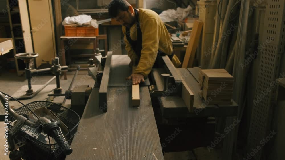 Slow Motion Close Up of Table Saw Cutting Wood on Construction Site