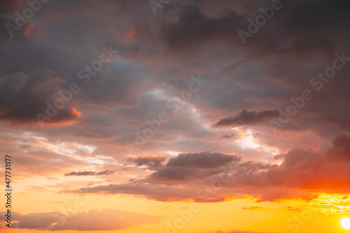 5K 4K Sunset Cloudy Sky With Fluffy Clouds. Sunset Sky Natural Background. Dramatic Sky. Sunset In Yellow, Orange, Pink Colors. Day To Night Transition. Cloudy Sky With Fluffy Clouds. Natural © Grigory Bruev