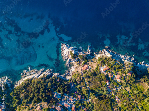 Aerial drone panorama view of the coast line, beach and crystal clear water of elba close to Sant'Andrea, Italy