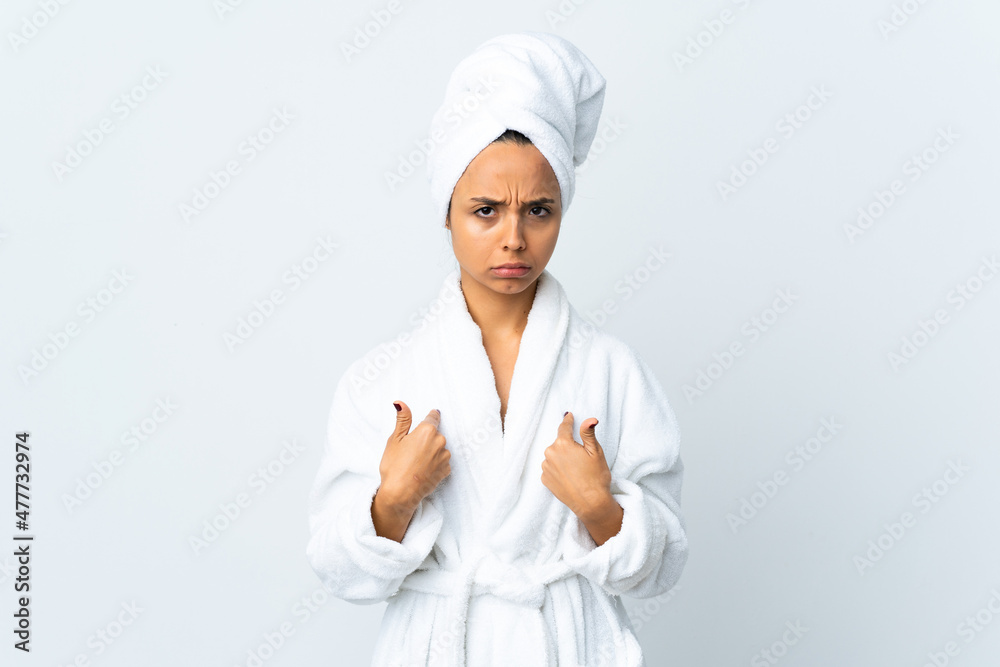 Young woman in bathrobe over isolated white background pointing to oneself Young woman in bathrobe over isolated white background pointing to oneself