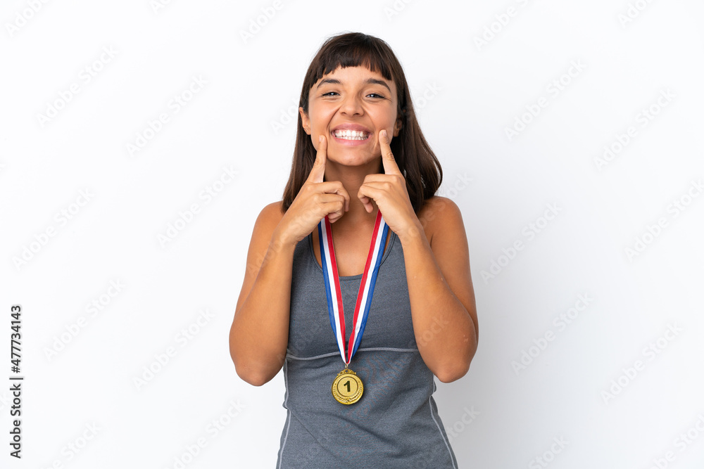 Young mixed race woman with medals isolated on white background smiling with a happy and pleasant expression Young mixed race woman with medals isolated on white background smiling with a happy and pleasant expression