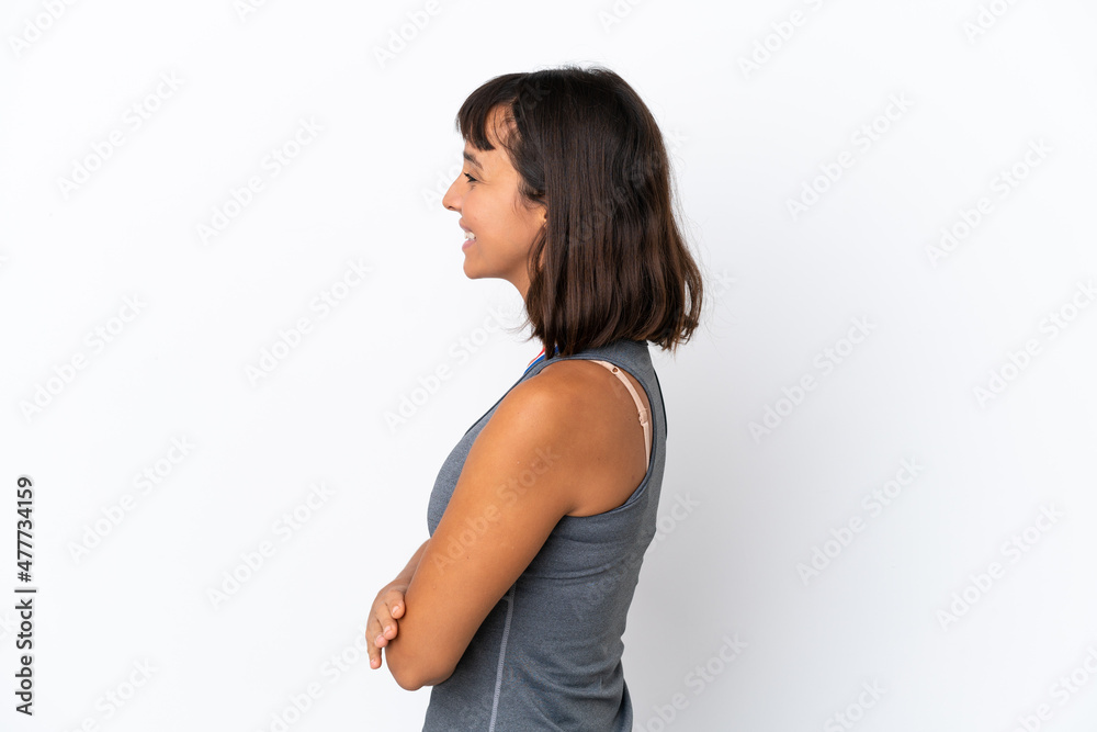Young mixed race woman with medals isolated on white background in lateral position Young mixed race woman with medals isolated on white background in lateral position
