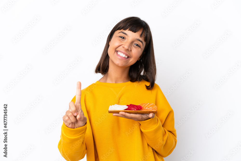 Young mixed race woman holding sashimi isolated on white background showing and lifting a finger Young mixed race woman holding sashimi isolated on white background showing and lifting a finger