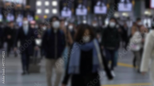Wallpaper Mural Defocused and slowmotion shot of large crowd business people inside metro station wearing surgical mask. Omicron variant coronavirus pneumonia. Blurred background in the scene Torontodigital.ca