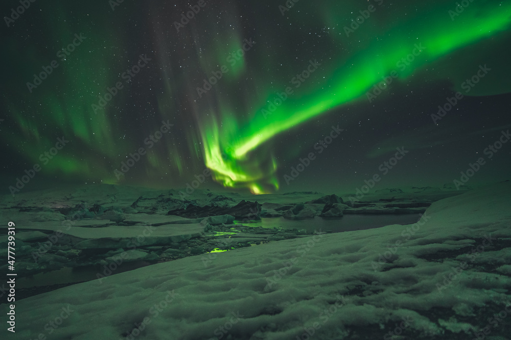 Northern Lights and Aurora Borealis over Joekulsarlon Glacier Lagoon in South Iceland