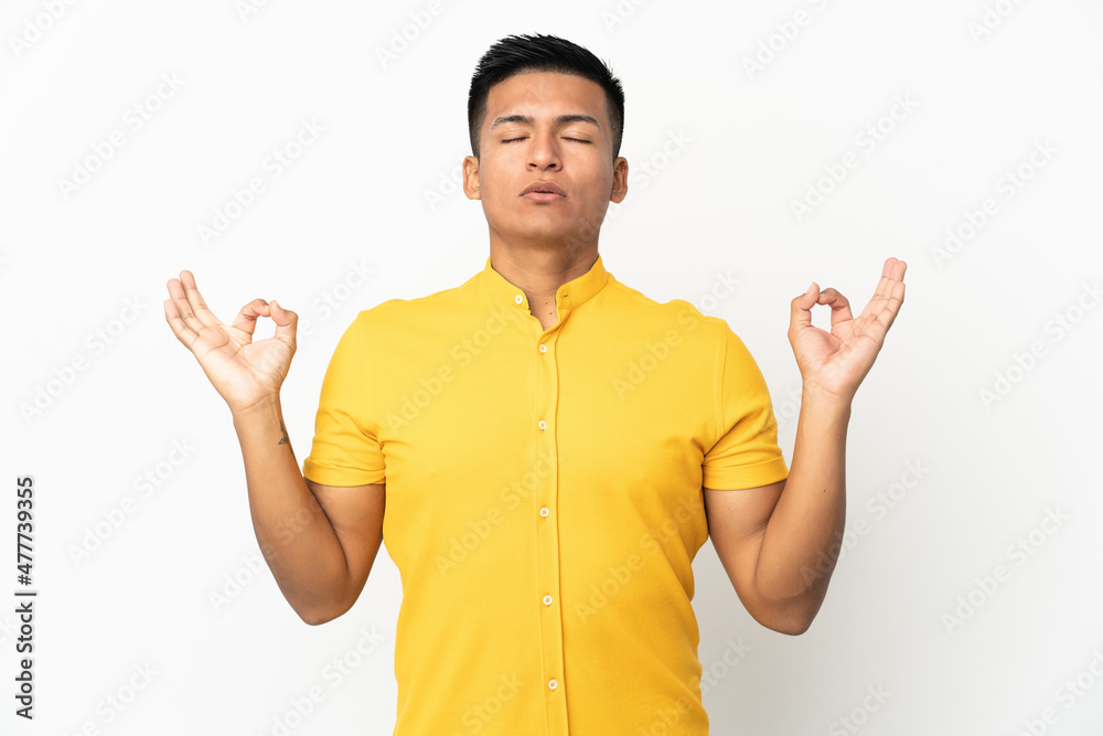 Young Ecuadorian man isolated on white background in zen pose Young Ecuadorian man isolated on white background in zen pose