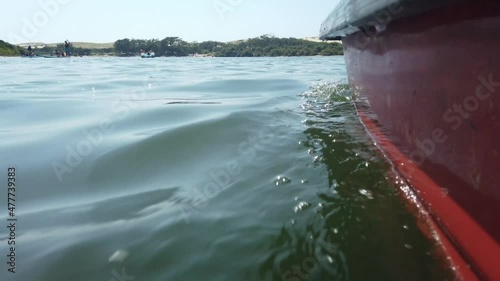 dolly shot from a pedalo on a lake photo