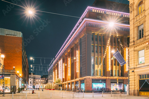 Helsinki, Finland. Building Of Department Store On Keskuskatu Street In Evening Or Night Christmas Xmas New Year Festive Illumination photo