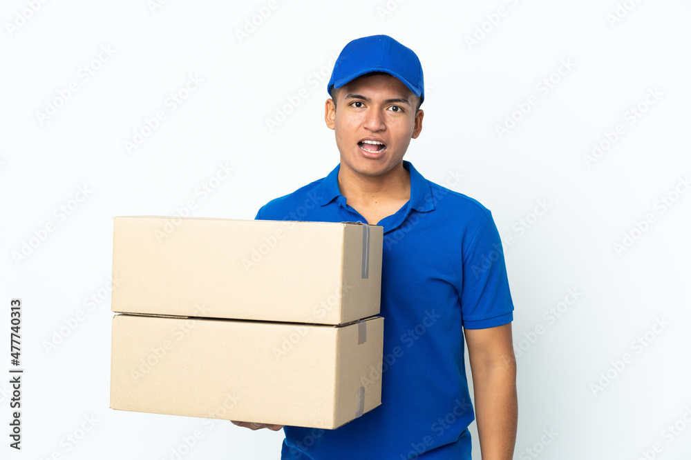 Delivery Ecuadorian man isolated on white background with surprise facial expression Delivery Ecuadorian man isolated on white background with surprise facial expression