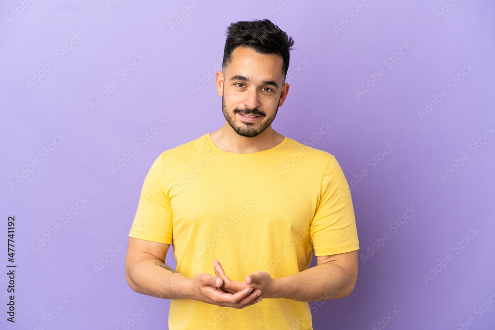 Young caucasian man isolated on purple background laughing Young caucasian man isolated on purple background laughing
