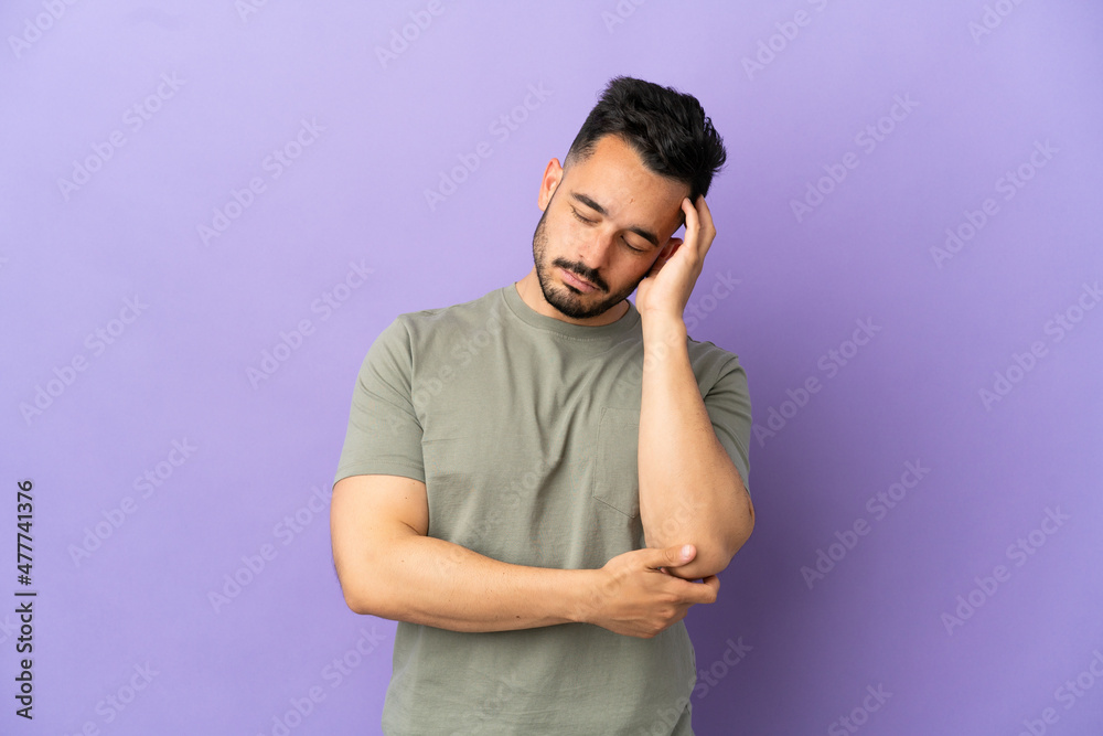 Young caucasian man isolated on purple background with headache Young caucasian man isolated on purple background with headache