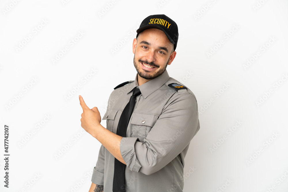 Young security caucasian man isolated on white background pointing back Young security caucasian man isolated on white background pointing back
