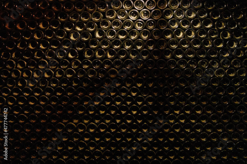 Wine Cellar wall with dusty bottles
