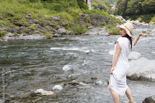 Girl playing in the river