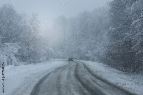 Snowy and frozen mountain road in winter landscape © Hakan Eliaçık