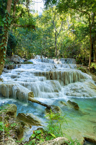 Erawan National Park  in Thailand. Erawan Waterfall is a popular tourist destination and famous for its emerald blue water. Deep forest in tropical climate with fantasy atmosphere. 