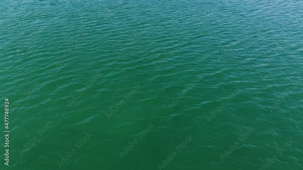 Aerial top view of turquoise water surface. Aerial view. Marine video background Aerial top view of turquoise water surface. Aerial view. Marine video background