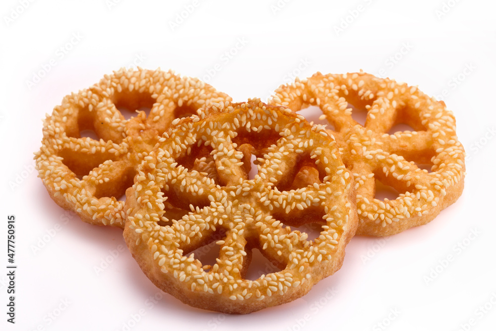 Shaking flower (kembang goyang) cake traditional from indonesia,Made from flour, sugar, milk, and baking powder.cake on white background 
