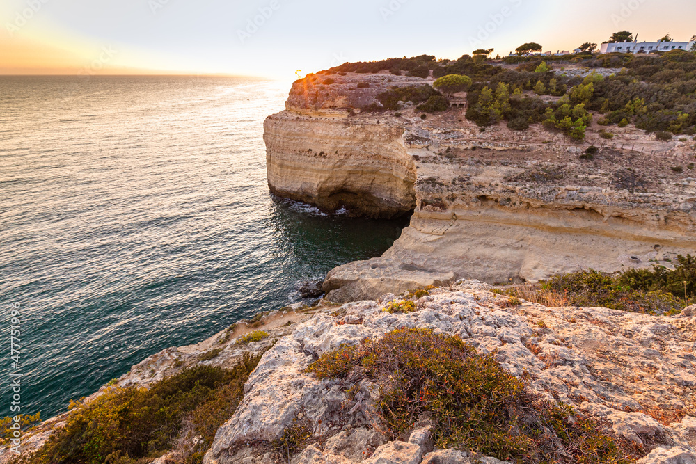 Stone cliffs and turquoise water at Algarve