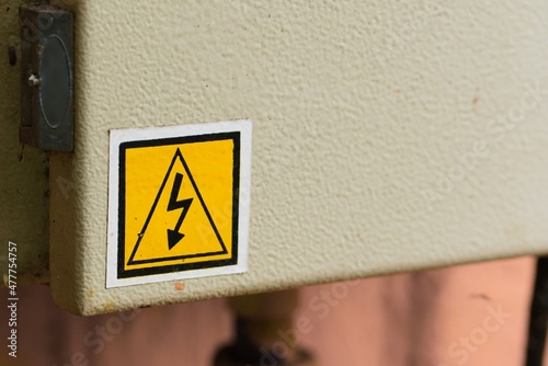 Electrical hazard warning sign in a metal box. Industrial safety concept.