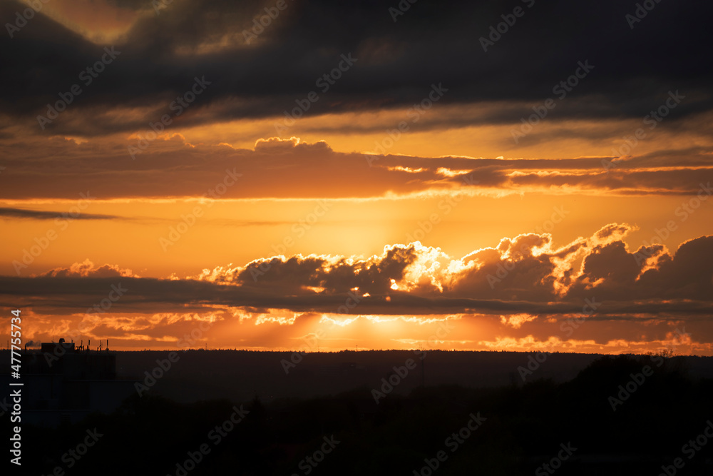 Sunset over a silhouetted landscape. Sunset over a silhouetted landscape.