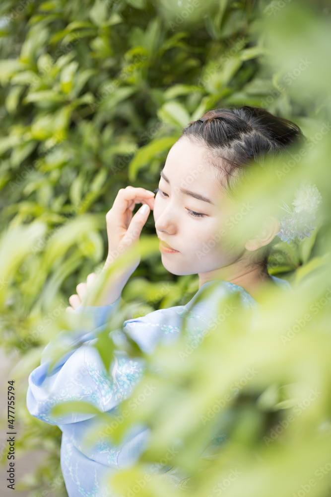 Woman in Japanese traditional fashion Woman in Japanese traditional fashion