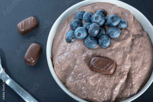 Traditional Finnish foods: Overhead shot of a bowl of chocolate porridge with blueberry topping