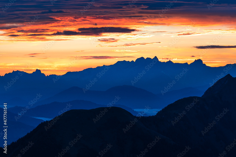 Epic sunrise above the rocky peaks of Austrian Alps in the early morning from Gleiwitzer Hutte. Sunrise in High Tauern. Dawn in the mountains. Glocknerrunde trail.
