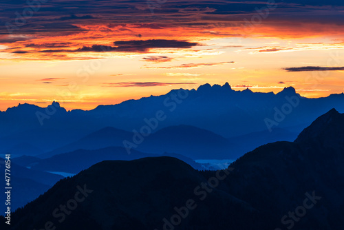 Epic sunrise above the rocky peaks of Austrian Alps in the early morning from Gleiwitzer Hutte. Sunrise in High Tauern. Dawn in the mountains. Glocknerrunde trail.