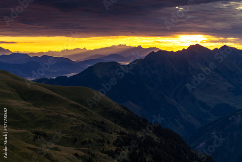 Epic sunrise above the rocky peaks of Austrian Alps in the early morning from Gleiwitzer Hutte. Sunrise in High Tauern. Dawn in the mountains. Glocknerrunde trail.