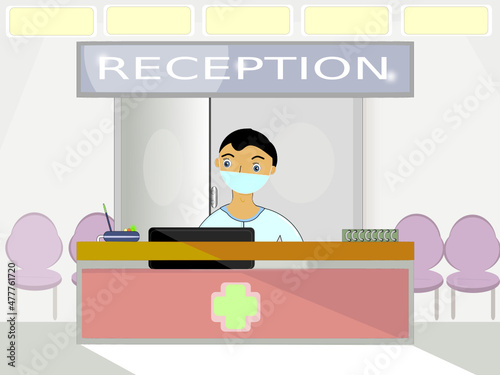 Young receptionist with anti Covid 19 mask from the healthcare sector behind the front desk interacts on the computer while backing up chairs waiting for vaccination or other ailments requiring medica