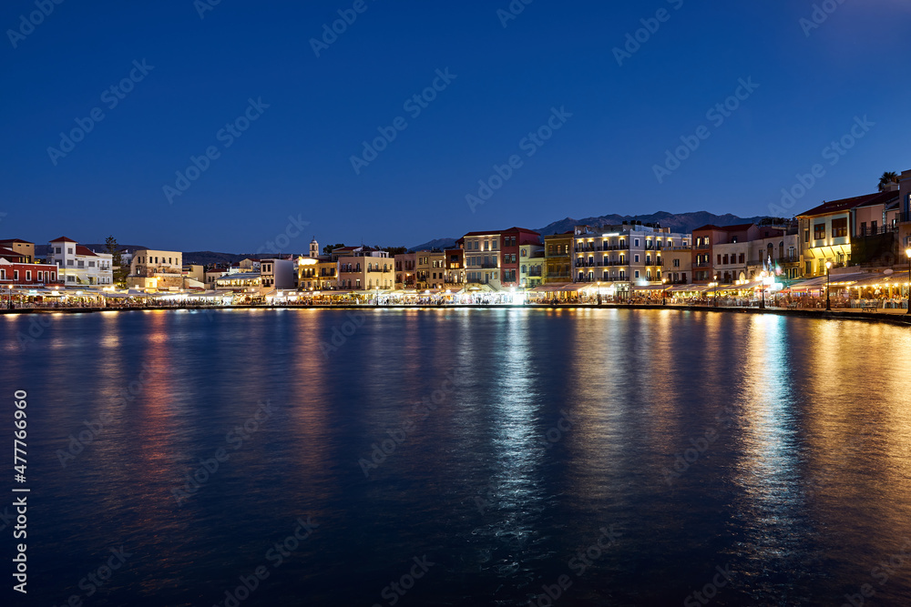 Taverns and houses in the evening in the port of Chania town
