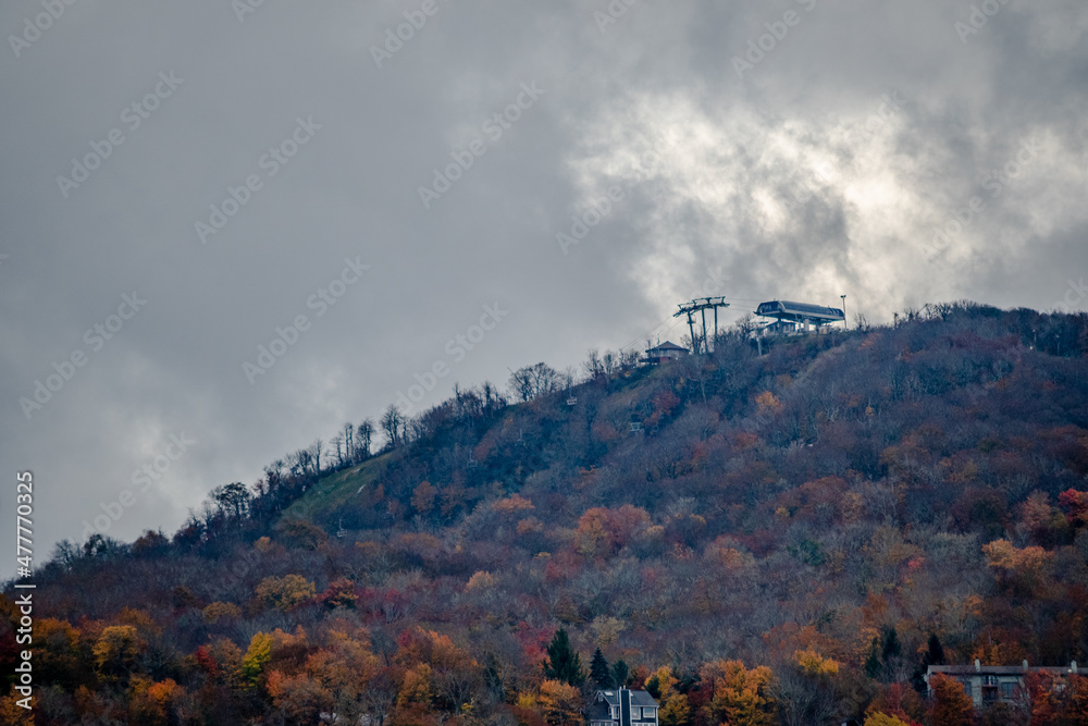 Mountain ridge in fall color, from Banner Elk, North Carolina, with cloudy skies Mountain ridge in fall color, from Banner Elk, North Carolina, with cloudy skies