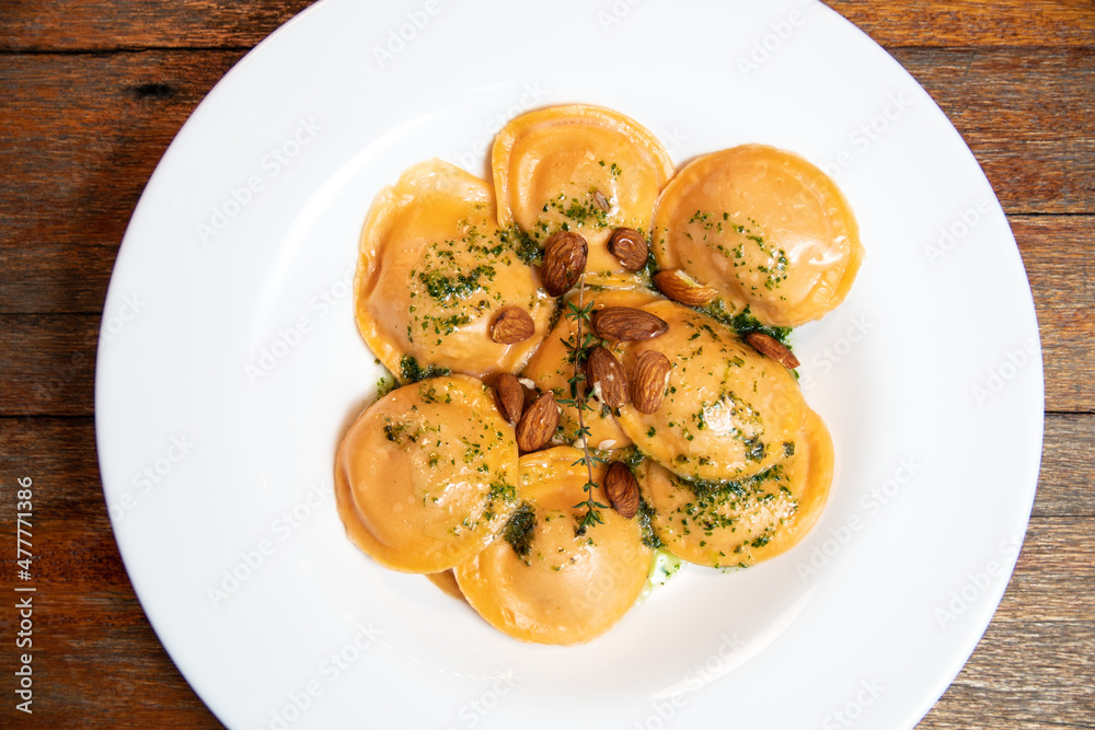 Ravioli with olive oil, oregano and almonds