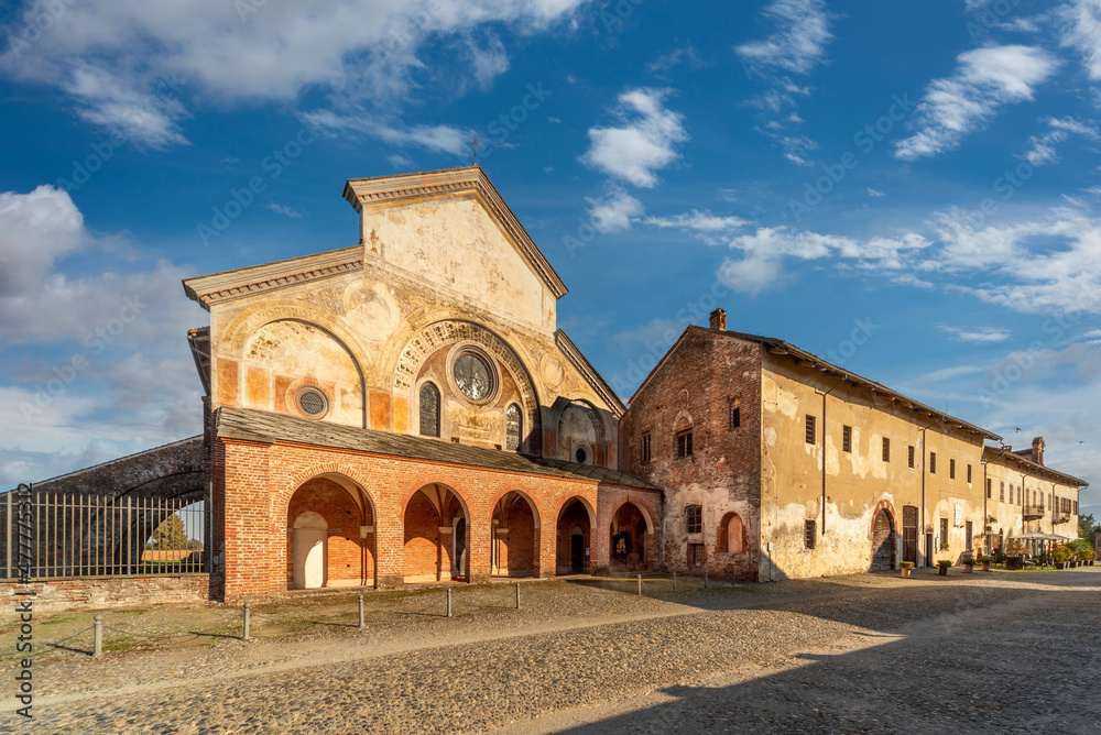 Staffarda di Revello, Saluzzo, Italy - October 8, 2021: Abbey of Santa Maria di Staffarda of Roman Gothic style (XII century), ancient medieval village near Saluzzo