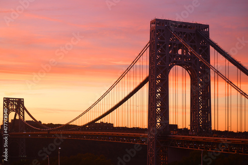 George Washington Bridge, double-decked suspension bridge spanning Hudson River on sunset. New York City, United States photo